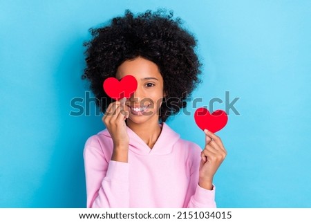 Photo of youth pretty lady have fun cover eye paper small heart romance present isolated over blue color background