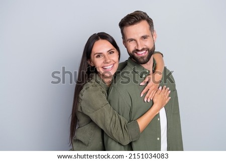 Portrait of attractive cheerful amorous couple best friends hugging romance spending time isolated over grey pastel color background Royalty-Free Stock Photo #2151034083
