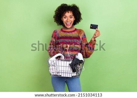 Photo of crazy astonished girl hold debit plastic card cashless nfc isolated on green color background