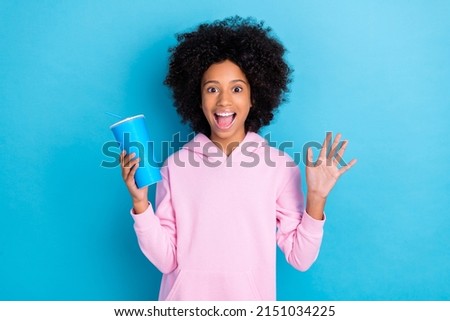 Portrait of attrctive trendy funky amazed cheerful girl drinking soda having fun free time isolated over vibrant blue color background Royalty-Free Stock Photo #2151034225