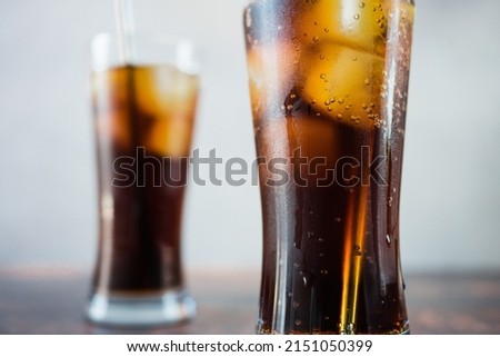 close up glasses with cola and ice, refreshing drink. Royalty-Free Stock Photo #2151050399