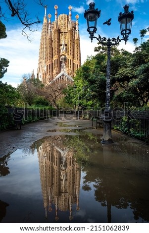 La Sagrada Familia of Barcelona with reflection in a pond after rain. Basilica La Sagrada Familia in Barcelona, Spain Royalty-Free Stock Photo #2151062839