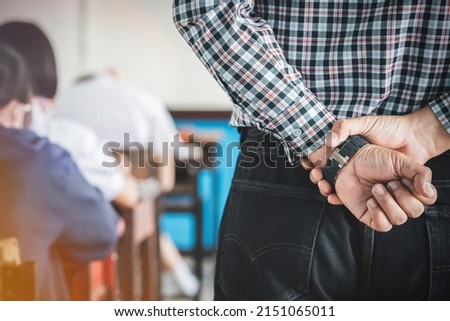 The teacher controls the exam room for students to take the exam in the classroom Royalty-Free Stock Photo #2151065011