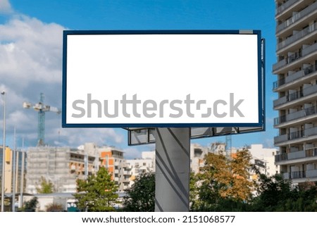 Advertising billboard mock-up on the residential area. There is construction site in the background