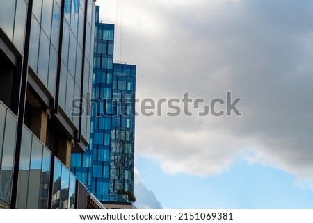 Modern office building with glass facade on a sunny summer day