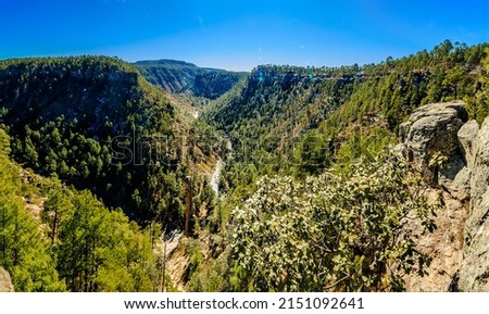 panoramic of green valley with rives between the mountains in the morning in guachochi chihuahua