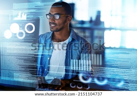 No glitches in this code. Shot of a happy computer programmer working on new software at his computer. Royalty-Free Stock Photo #2151104737