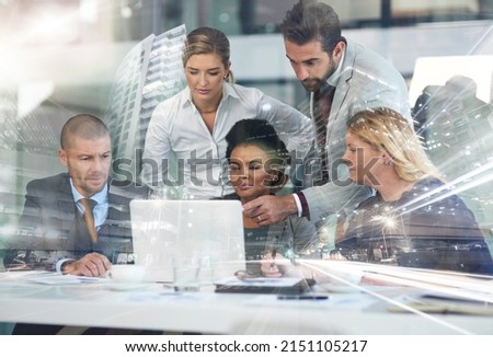 Theyre planning to take over the city. Multiple exposure shot of a group of businesspeople working together on a laptop superimposed over a cityscape. Royalty-Free Stock Photo #2151105217