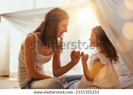 Lets make a promise. Shot of a mother and daughter coming together and making a pinky swear as a promise to one another. Royalty-Free Stock Photo #2151105255