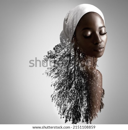 Be natural, be beautiful. Composite image of nature superimposed on a young woman. Royalty-Free Stock Photo #2151108859