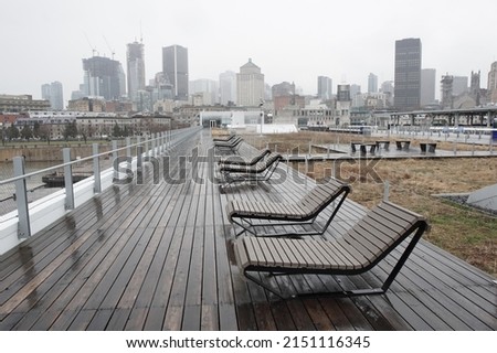 View of deck chairs at the Grand Quay of the Port of Montreal, Quebec on a rainy day
