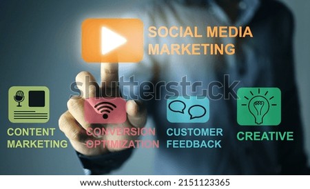 Businessman man pressing his hand on social media marketing icon and other online marketing icons. Online Marketing Concept.