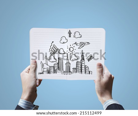 Close up of businessman hands holding opened notepad with sketches