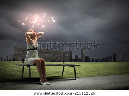 Young woman sitting on bench closing ears with palms and screaming