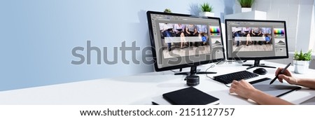 Female Editor Working With Photos On Computer