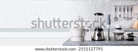 Various Type Of Kitchen Appliances On Worktop In Kitchen Royalty-Free Stock Photo #2151127795