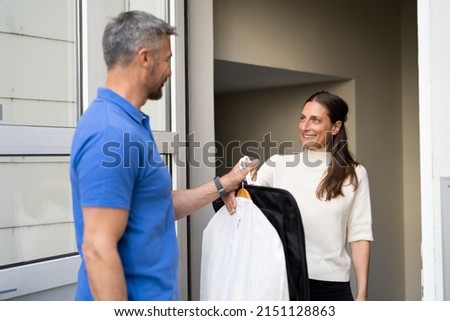 Delivering Dry Cleaning Service Package. Commercial Clothes Chemic Laundry Royalty-Free Stock Photo #2151128863