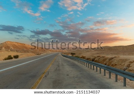 beautiful road at sunset in Negev desert Israel