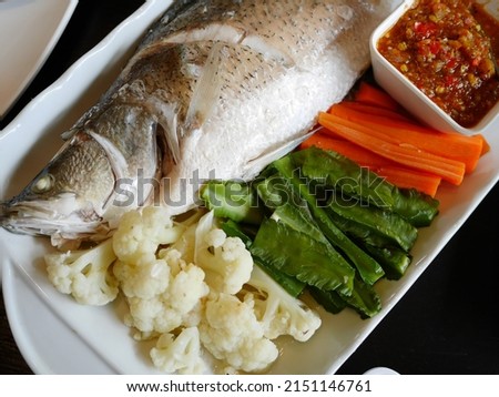 Steamed fish with seafood sauce and poached vegetables