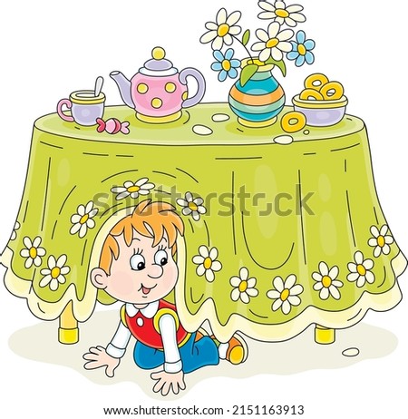 Little boy playing hide and seek under a table with a beautiful tablecloth and a tea set in a kitchen, vector cartoon illustrations isolated on a white background
