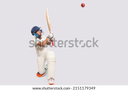 Portrait of boy hitting a shot During a Cricket Game Royalty-Free Stock Photo #2151179349