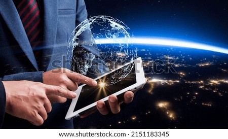 Businessman using digital tablet. Business global internet connection application technology digital marketing, Financial and banking with earth background. Elements of this image furnished by NASA