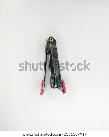 paper stapler for office, school and home supplies. taken with a white paper background.