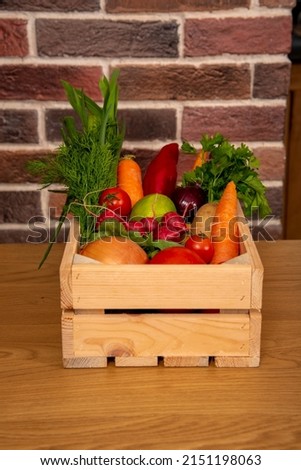 Healthy food in home made wooden basket on brick wall. Different vegetables. All views, front view, rear view, top view, angle view. High resolution products with perspective.