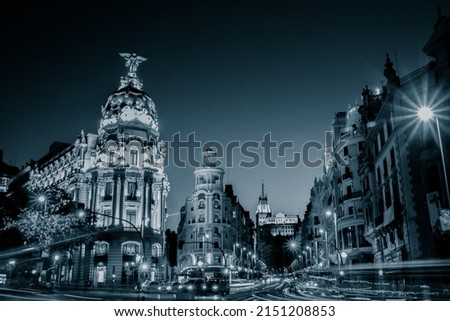 Rays of traffic lights on Gran via street, main shopping street in Madrid at night. Spain, Europe Royalty-Free Stock Photo #2151208853