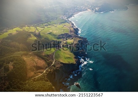Rocky shore with green meadow, aerial view. Bay of Biscay Coast, Northern Spain