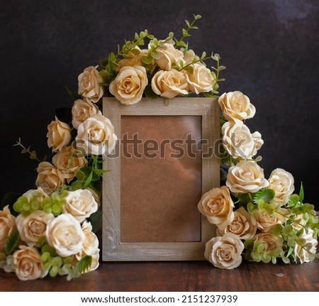 Empty Photo Frame With Yellow Roses On Texture Background
