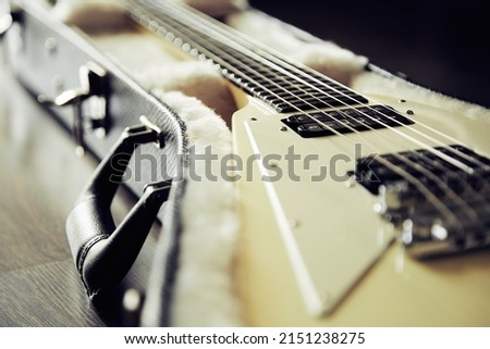White electric guitar in the hard case
