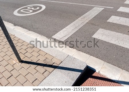 A vertical shot of a road with road marking in a city