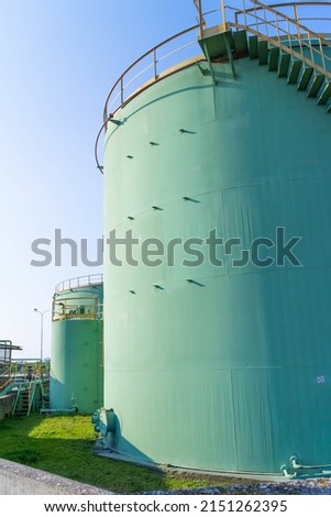 View of storage tank and pipes of chemical industry, Italy. High quality photo