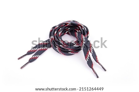 navy blue, red, white shoe paper on a white background. navy blue shoelace