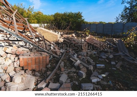Destroyed residential private house due to explosion. The collapse of a brick house, the collapse of the walls