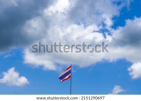 Thai flag waving picture of Thailand with blue sky background at Thailand.