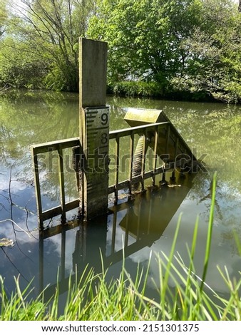 Water Depth Indicator and Gate in Lake Royalty-Free Stock Photo #2151301375