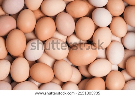 Eggs background. Top view, food background. A lot of organic farm eggs close up.