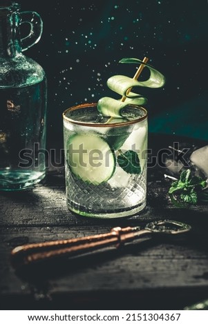 cucumber and basil cocktail with bubbles and bottle opener