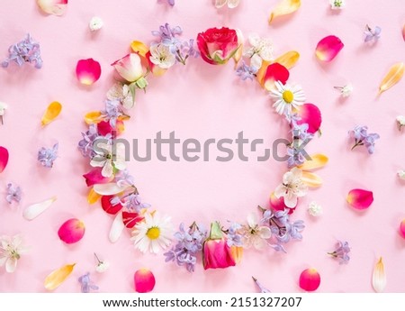 Spring flower composition with copy space on pink background