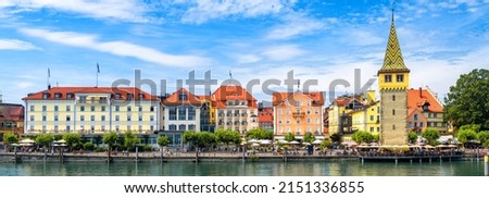 Panorama of Lindau city, Germany, Europe. It is tourist attraction of Bavaria. Panoramic view of houses on Lindau island, landscape of Lake Constance (Bodensee) in summer. Travel and tourism concept. Royalty-Free Stock Photo #2151336855