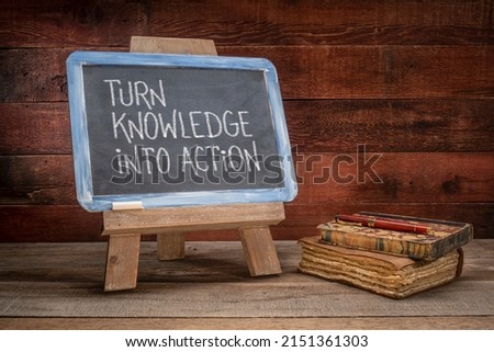 turn knowledge into action  - motivational advice on a vintage slate blackboard in a retro classroom Royalty-Free Stock Photo #2151361303