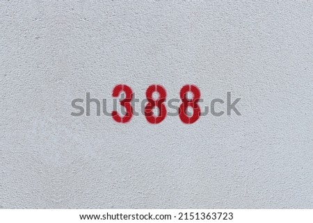 RED Number 388 on the white wall. Spray paint.three hundred and eightythree hundred and eighty
