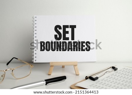 Set boundaries, text words typography written on paper against wooden background Royalty-Free Stock Photo #2151364413