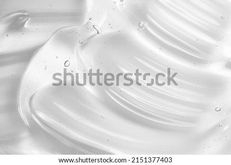 Gel serum texture. Clear liquid skincare cream background. Cosmetic gel with bubbles macro Royalty-Free Stock Photo #2151377403