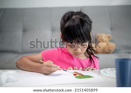 Girl PaintingGirl Painting Picture On Table At Home Picture On Table At Home