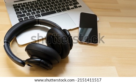 Laptop and headphones on the desk