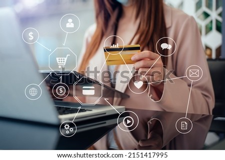 Business woman hands using smartphone and holding credit card sitting. Online Shopping payments  concept. with VR icon