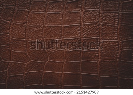 Close-up of dark leather with patterns